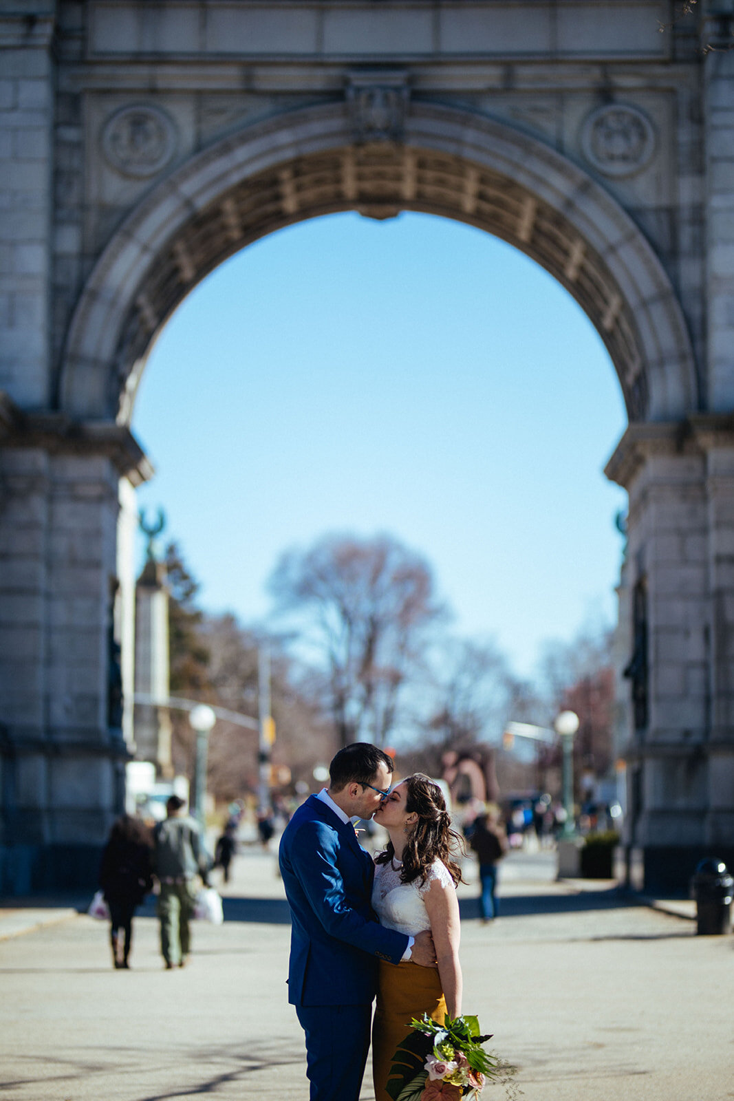 Bride and groom kissing under the Grand Army Plaza Arch NYC Shawnee Custalow wedding photography