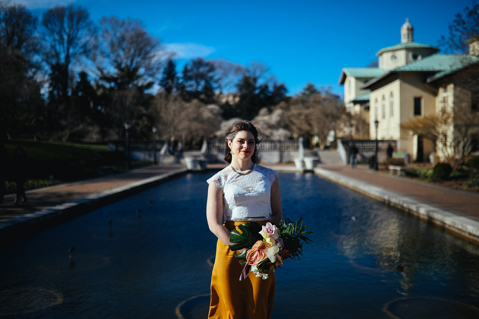 Bride by a pool at the Brooklyn Botanical Garden Shawnee Custalow wedding photography