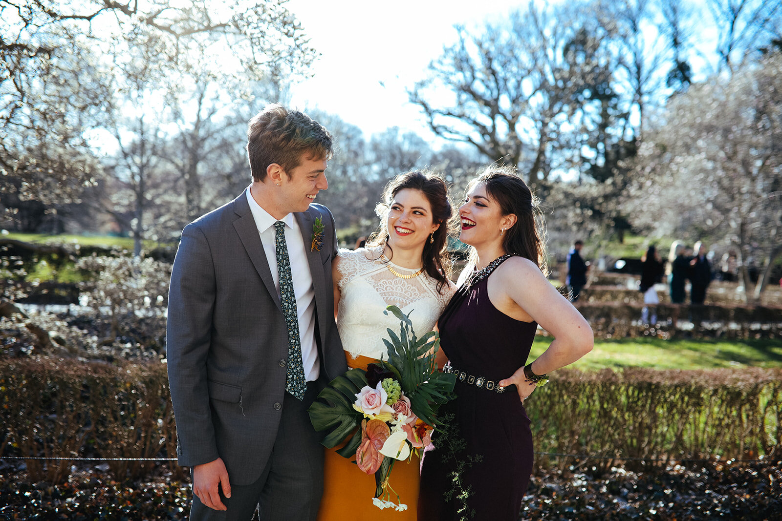 Bride posing with two guests at the Brooklyn Botanical Garden NYC Shawnee Custalow photography