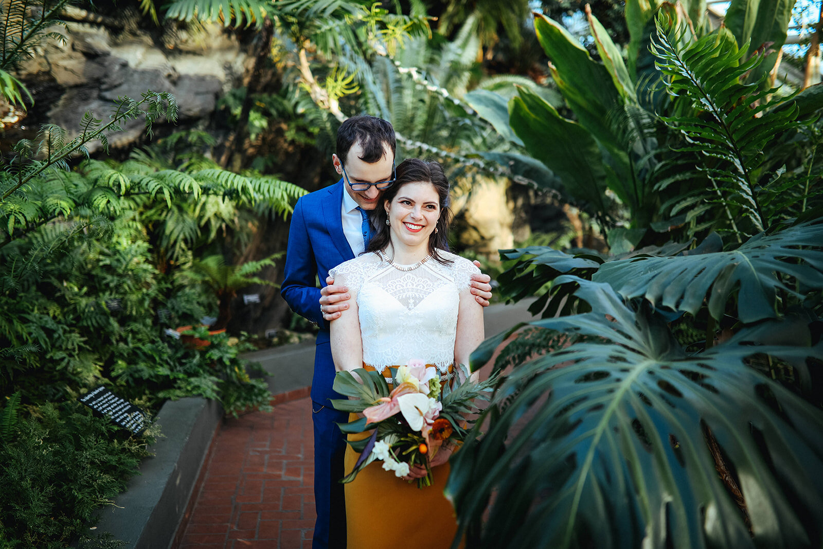 Groom holding the bride at the Brooklyn Botanical Garden Shawnee Custalow wedding photography