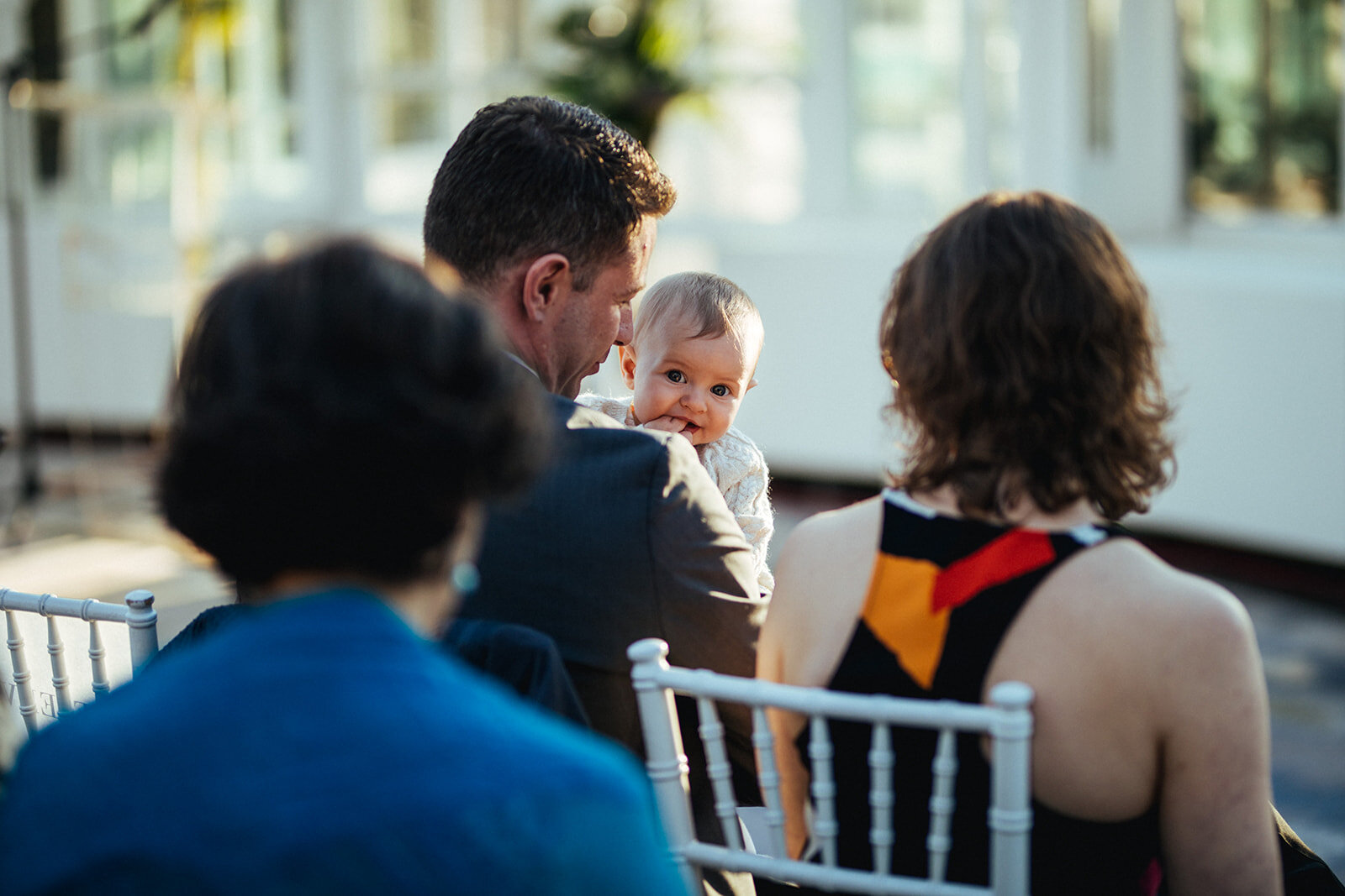 Guests and baby seated at Brooklyn Botanical Garden wedding NYC Shawnee Custalow photography