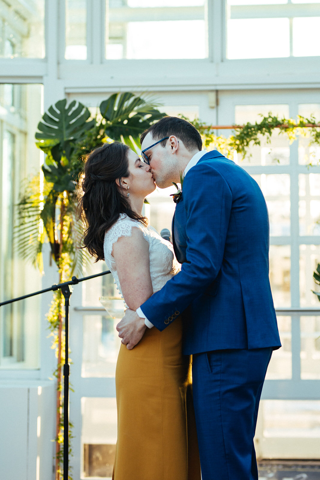 Newly married bride and groom kissing at the Brooklyn Botanical Garden Shawnee Custalow wedding photography