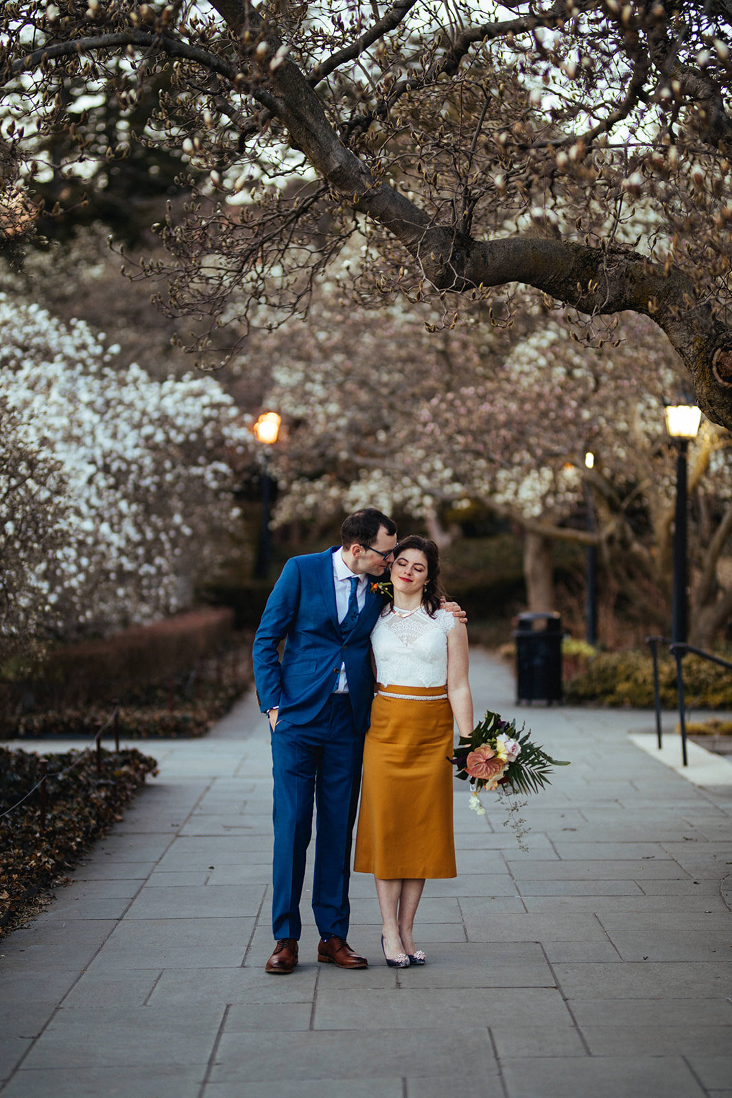 Groom leaning in to kiss the brides cheek at Brooklyn Botanical Garden Shawnee Custalow photography