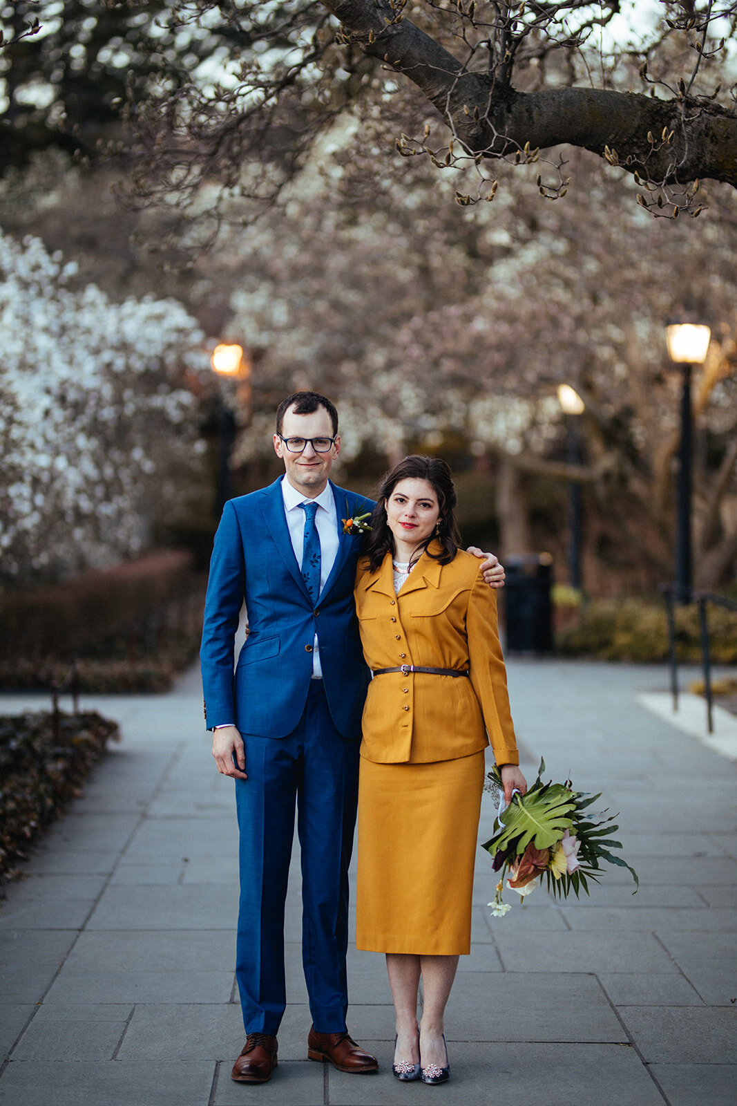 Bride and groom in yellow and blue at the Brooklyn Botanical Garden Shawnee Custalow wedding photography