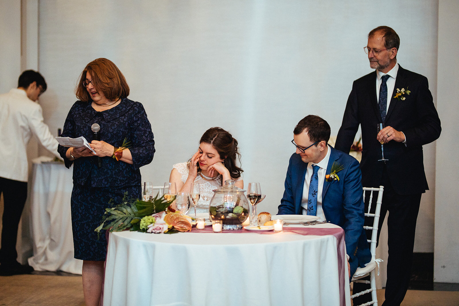 Bride and groom listening to a speech at their reception at Brooklyn Botanical Garden NYC Shawnee Custalow