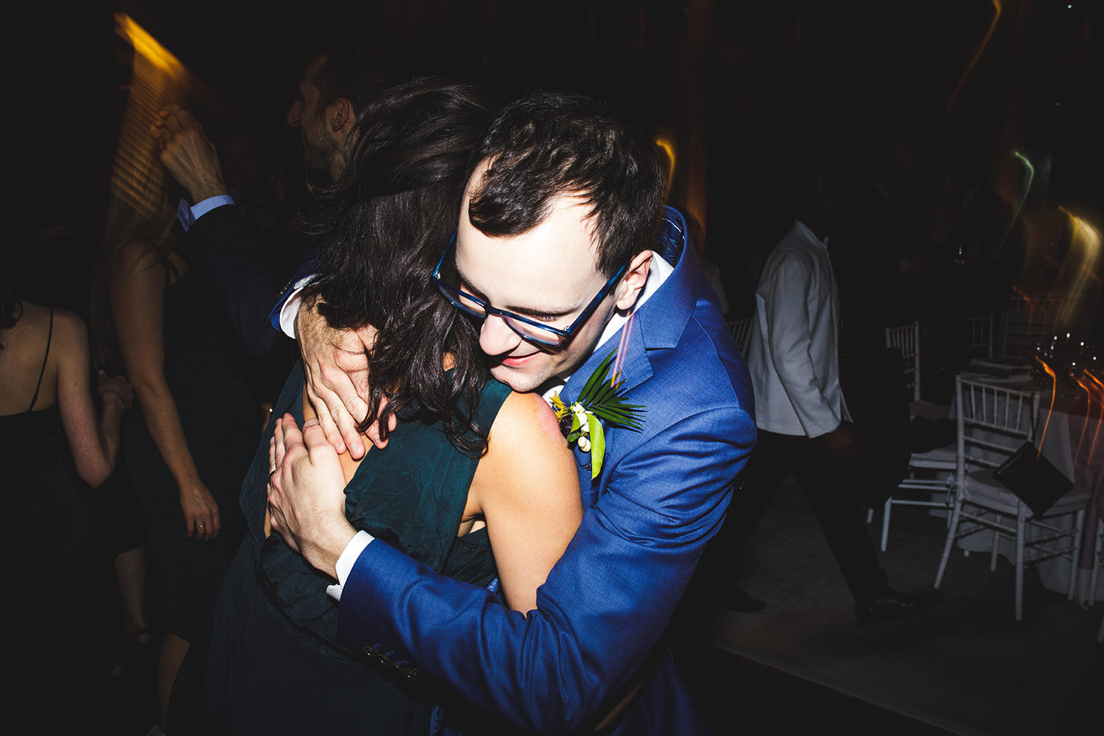 Groom hugging a guest at the Brooklyn Botanical Garden NYC Shawnee Custalow wedding photography