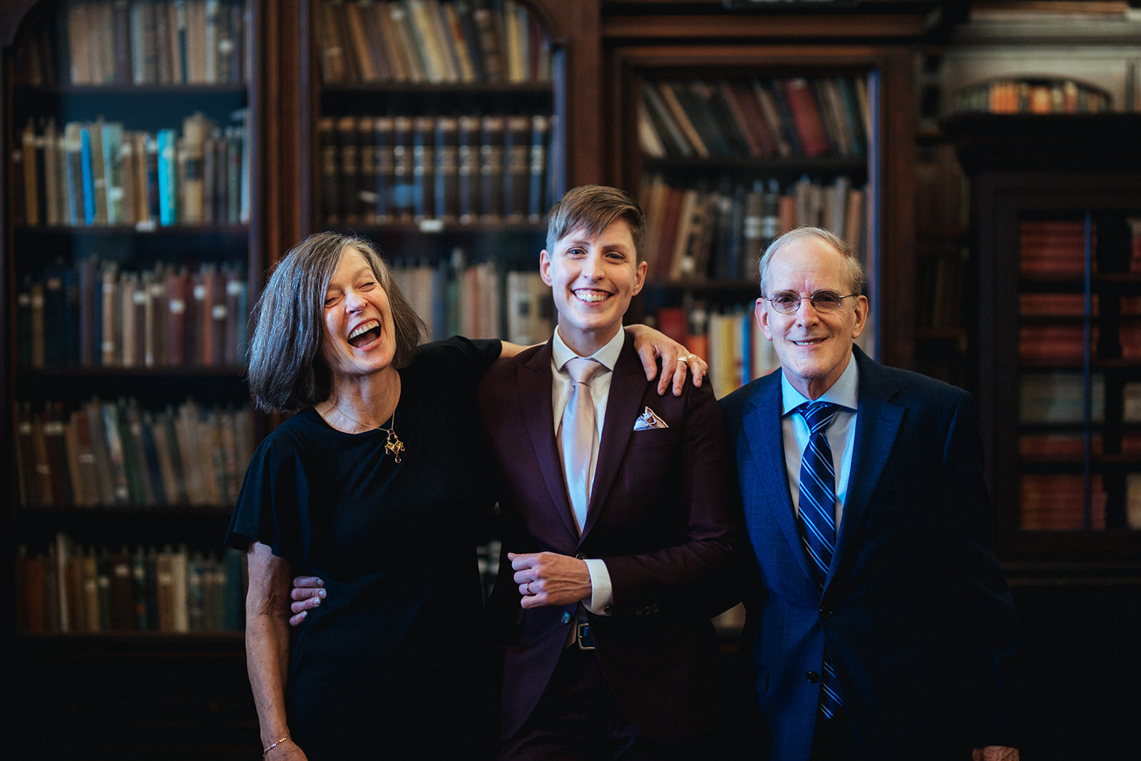 Happy newlywed posing with parents at German Society of PA Shawnee Custalow LGBTQ wedding Photography