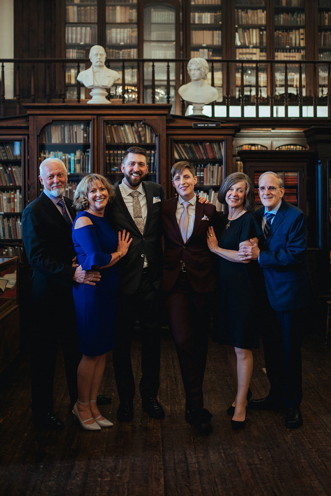 Newlywed LGBTQ couple with parents at German Society of PA Library Shawnee Custalow wedding Photography