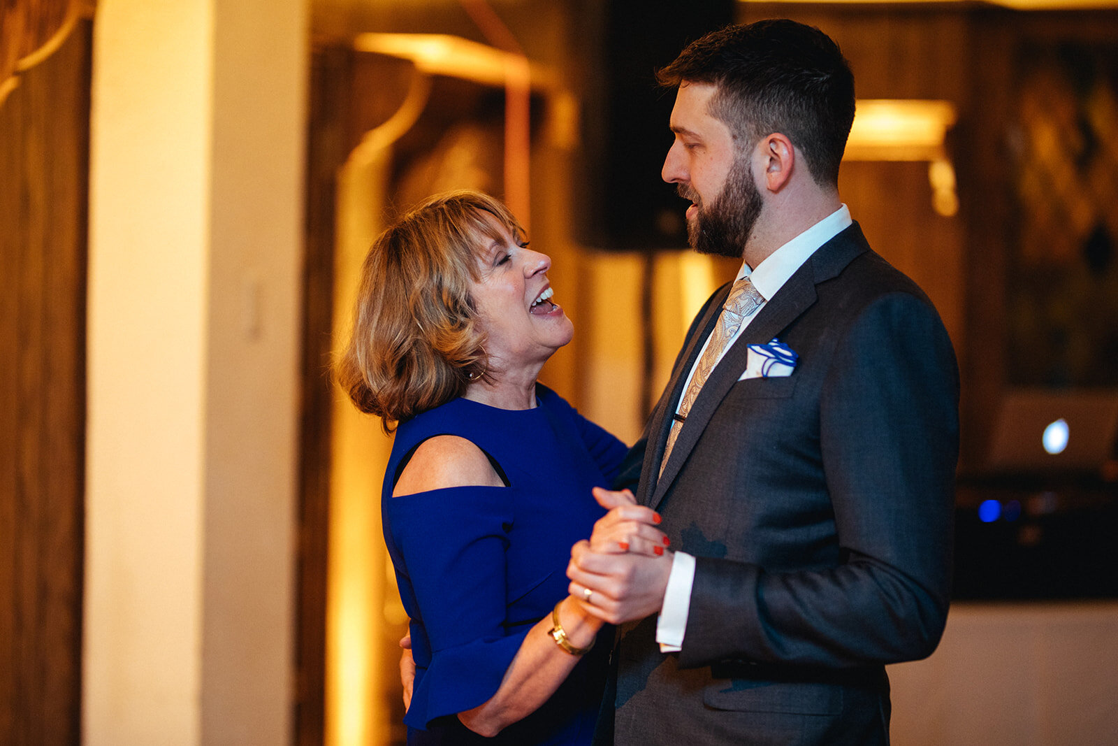 Groom dancing with mother in Philadelphia PA Shawnee Custalow LGBTQ wedding Photography