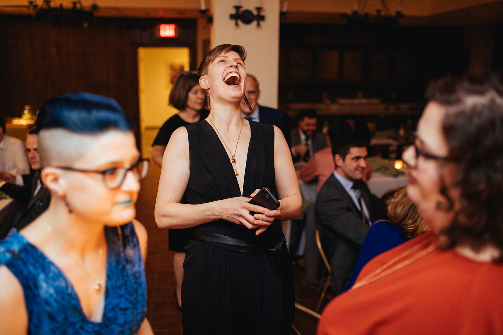 Happy newlywed laughing in Philadelphia PA Shawnee Custalow LGBTQ wedding Photography