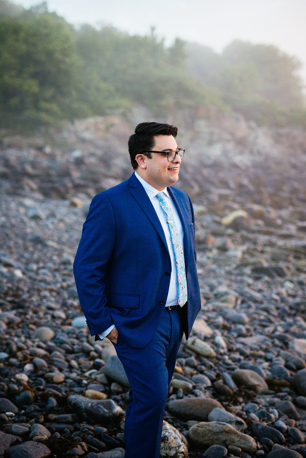 Portrait of a future spouse in a blue suit on Peaks Island Portland ME Shawnee Custalow Queer wedding photography