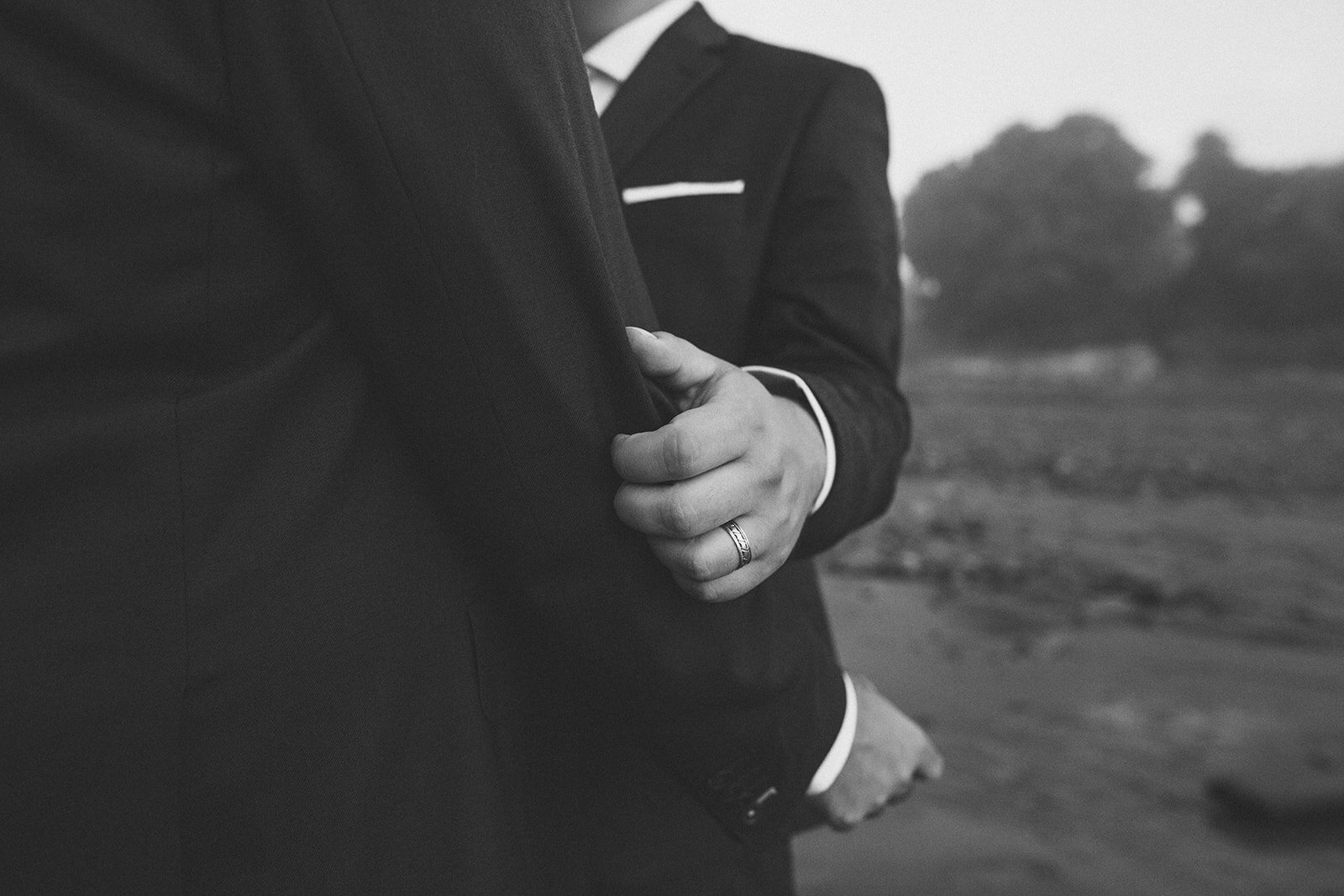 Close up of grooms wedding band on Peaks Island Portland ME Shawnee Custalow Queer wedding photography