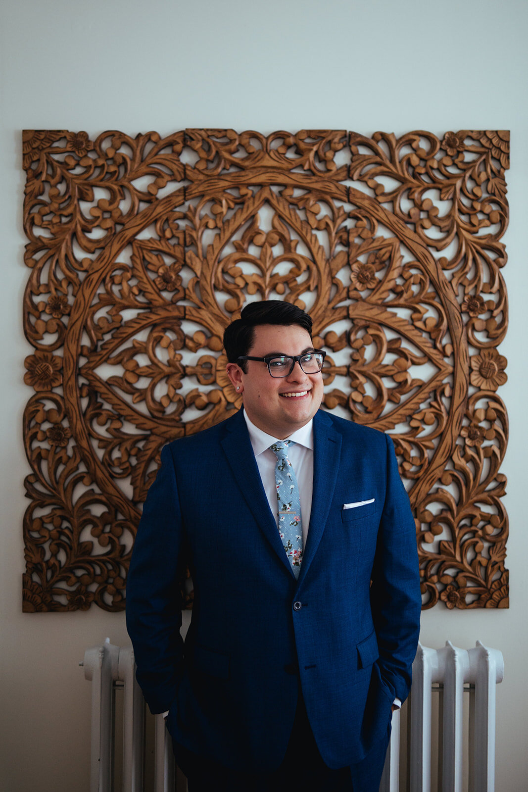 Portrait of groom in blue suite and tie Portland ME Shawnee Custalow Queer wedding photography