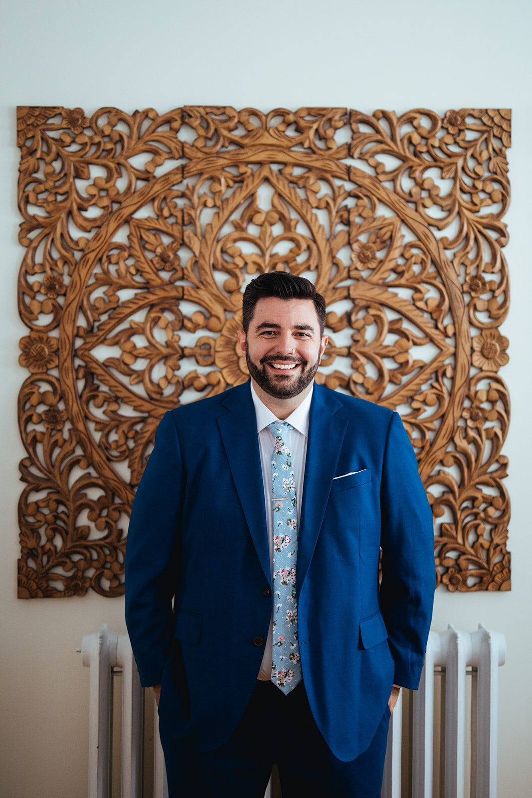 Groom in blue suite and tie in Portland ME Shawnee Custalow Queer wedding photography