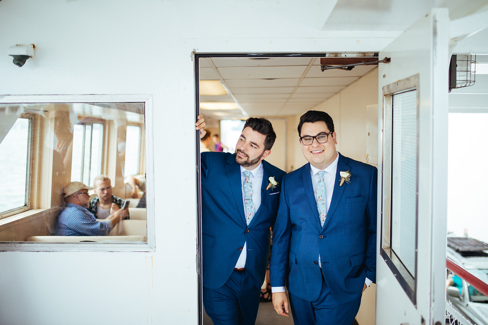 LGBTQ couple on a ferry to their wedding in Portland ME Shawnee Custalow Queer wedding photography