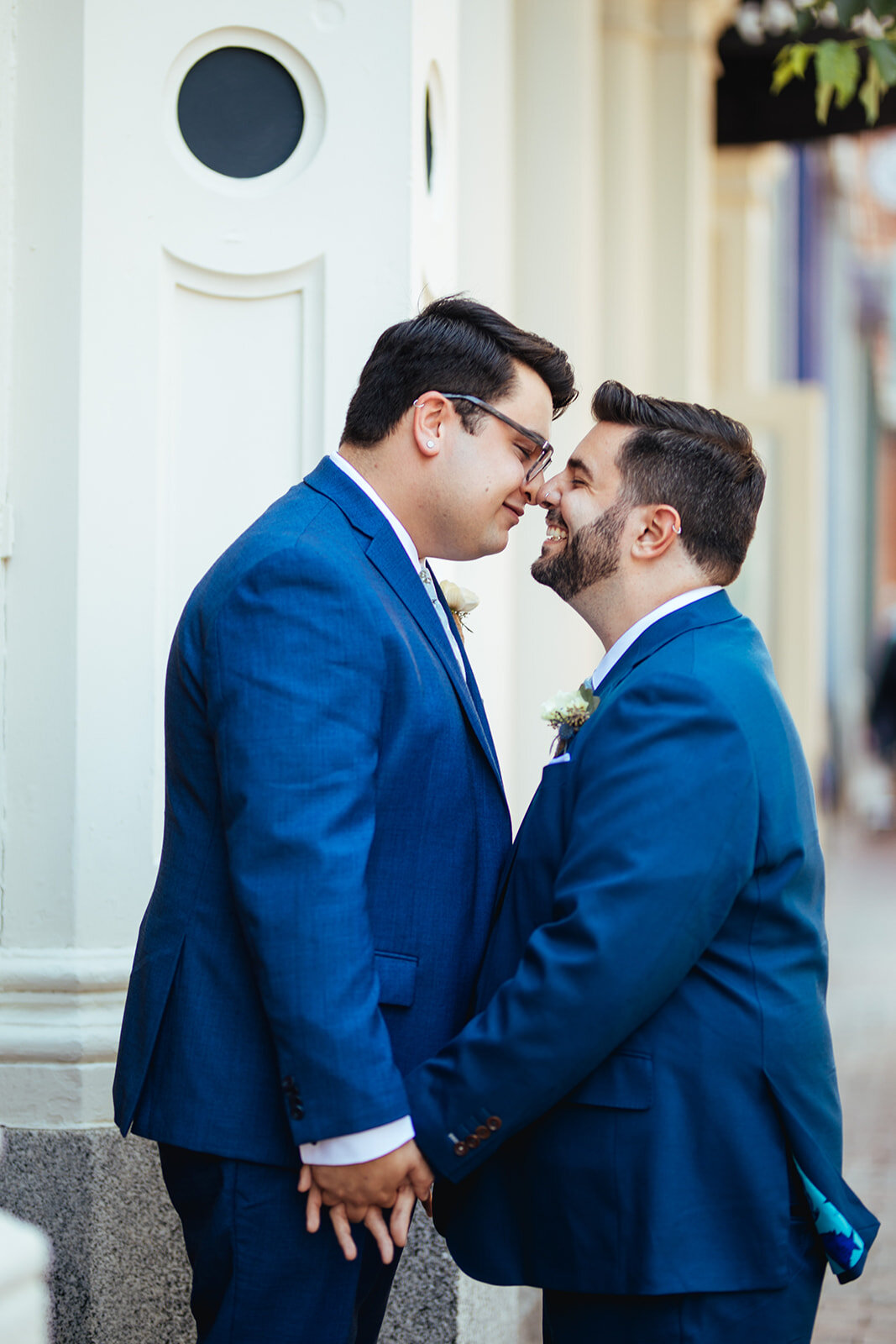 LGBTQ touching noses on their wedding day in Portland ME Shawnee Custalow wedding photography