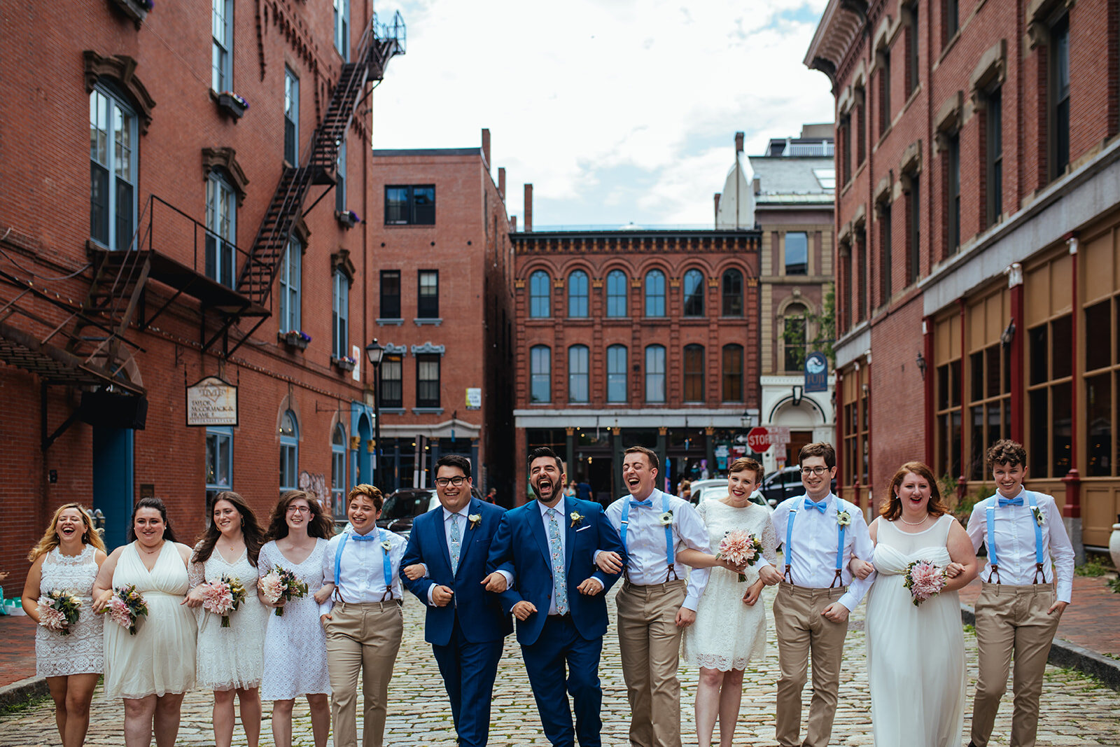 LGBTQ couple with wedding party in Portland ME Shawnee Custalow Queer wedding photography