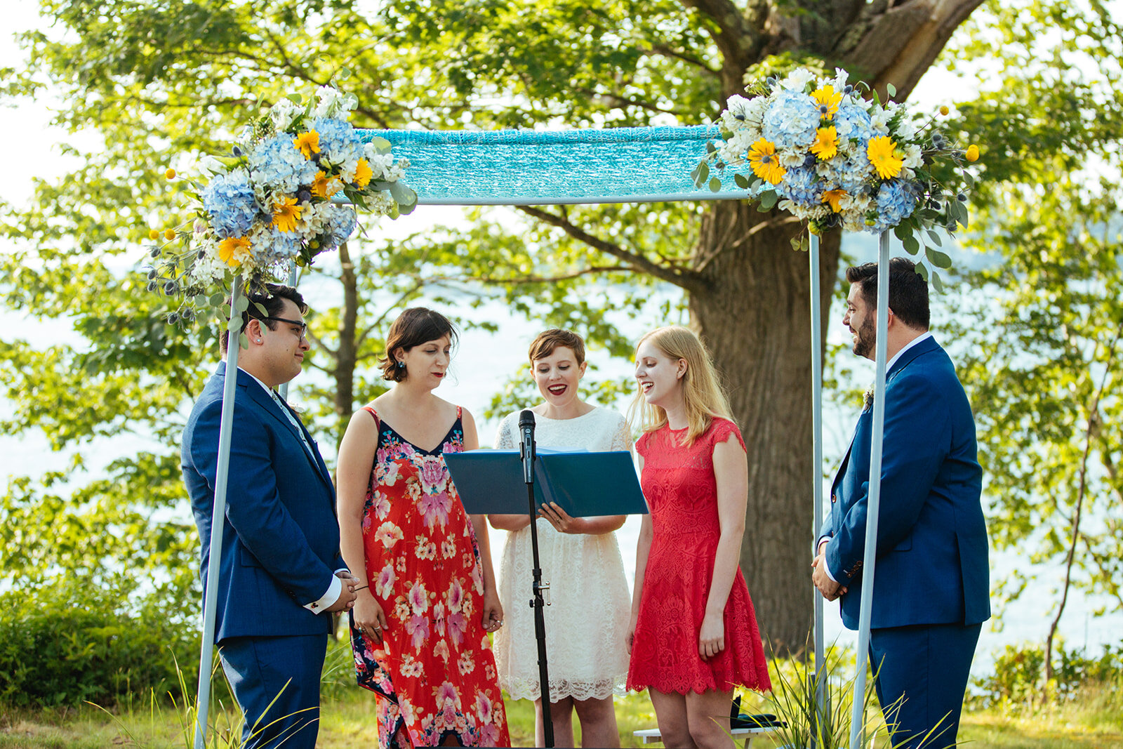 Three guests speaking during wedding ceremony in Portland ME Shawnee Custalow Queer wedding photography