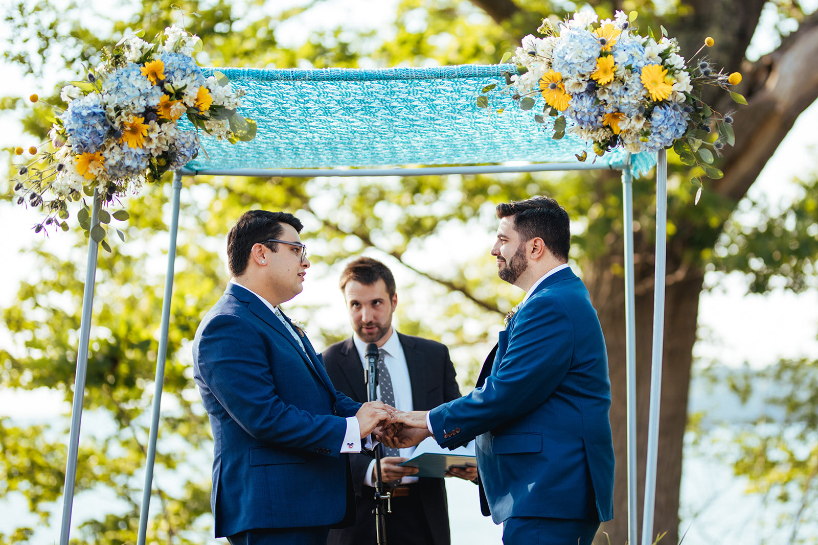 Officiant marrying a same sex couple on peaks island Portland ME Shawnee Custalow Queer wedding photography