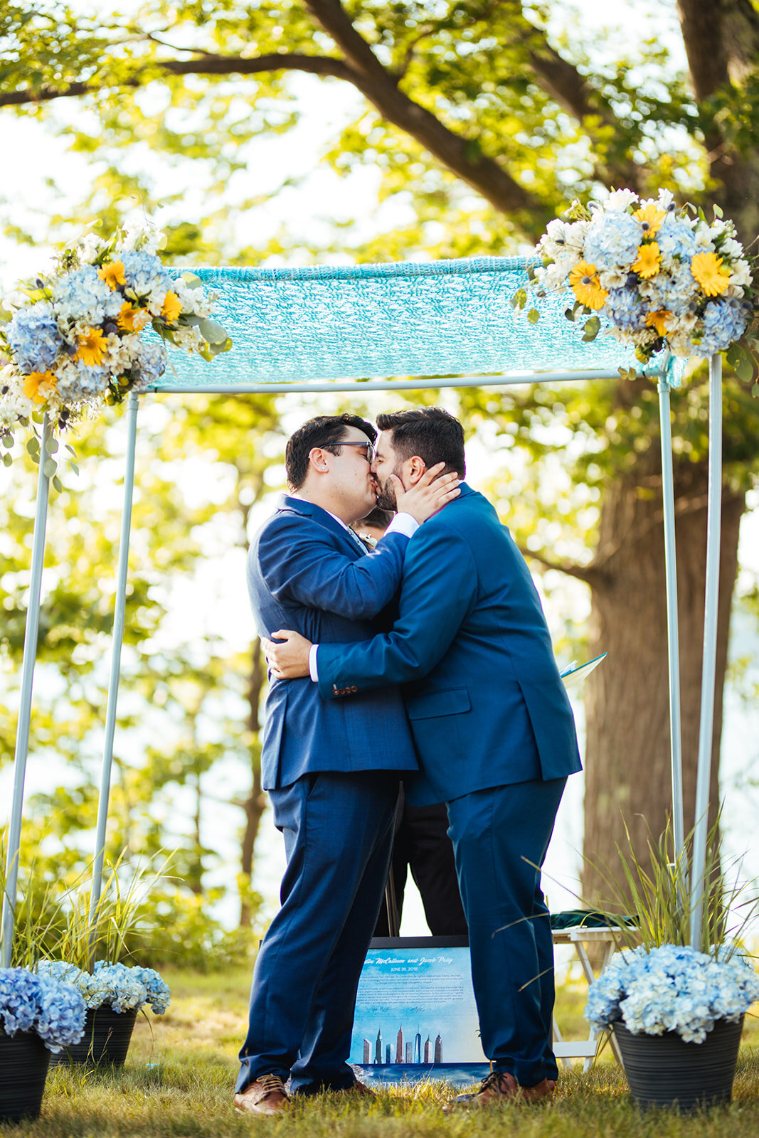 Newlywed lgbtq couple kissing on peaks island Portland ME Shawnee Custalow Queer wedding photography