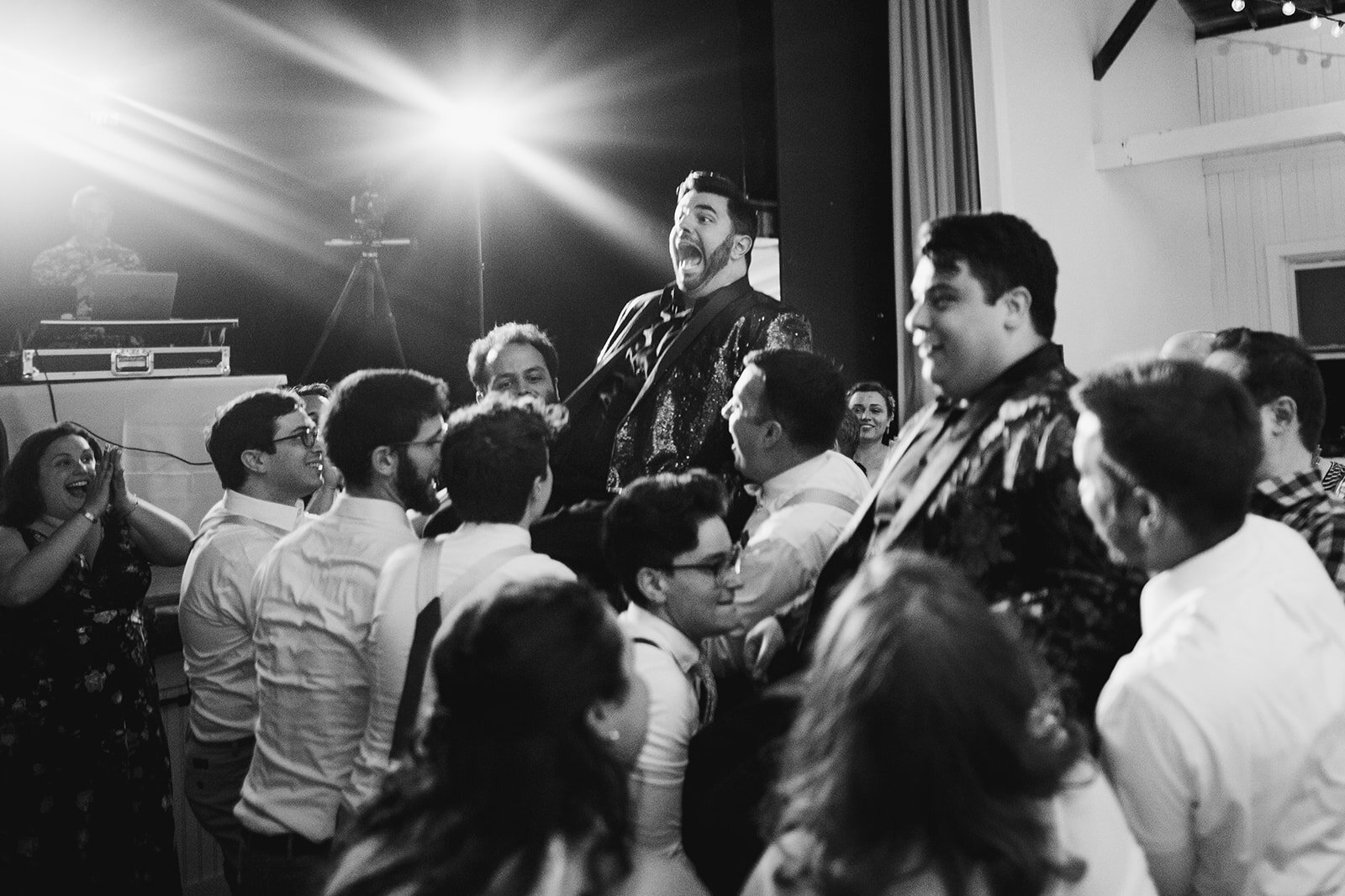 Guests and grooms dancing the Hora in Portland ME Shawnee Custalow Queer wedding photography