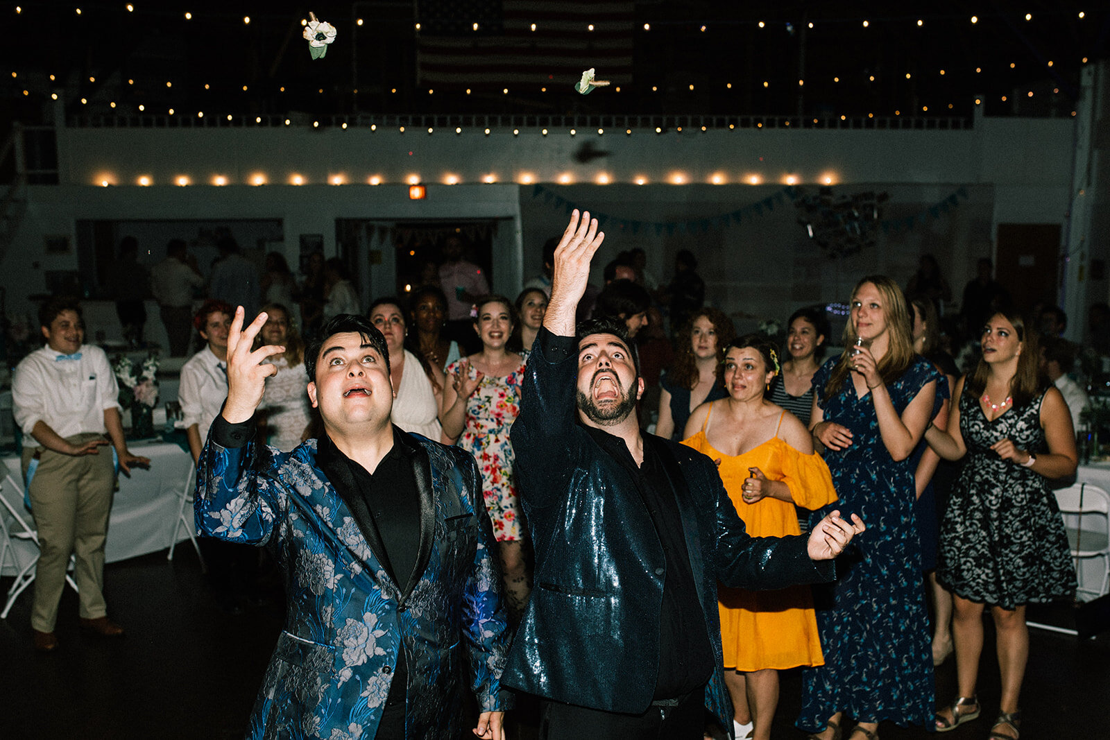 Newlyweds and guests dancing in Portland ME Shawnee Custalow Queer wedding photography
