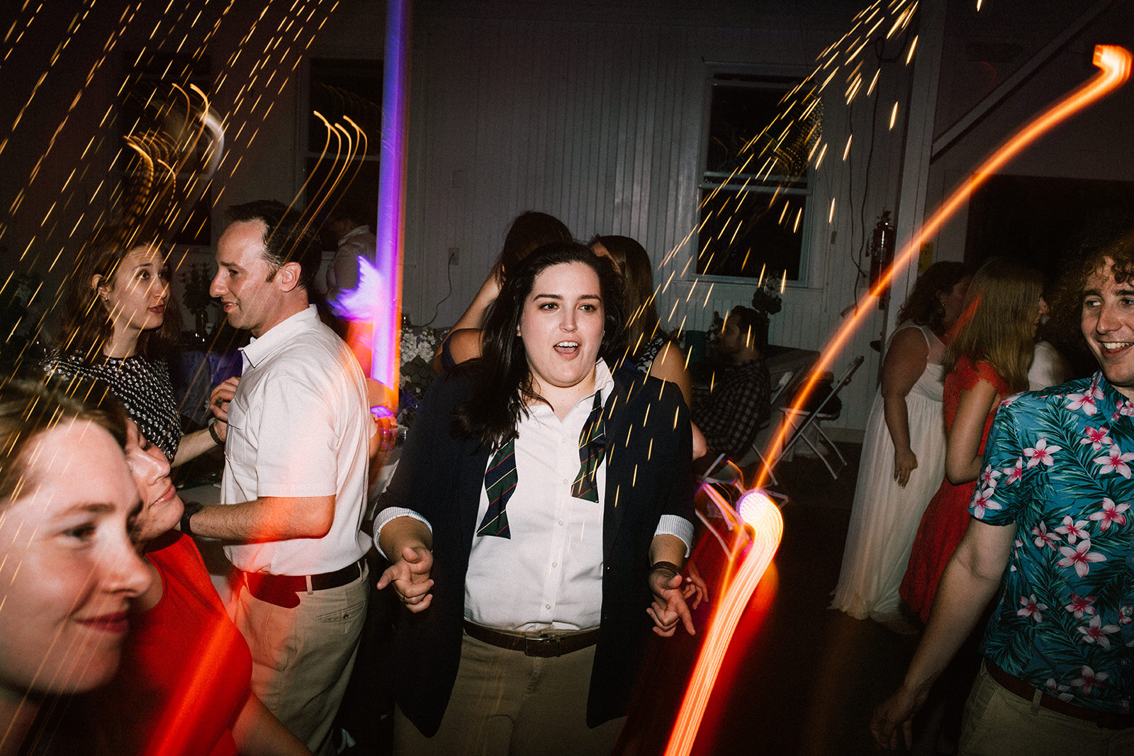 Wedding guests dancing in Portland ME Shawnee Custalow Queer wedding photography