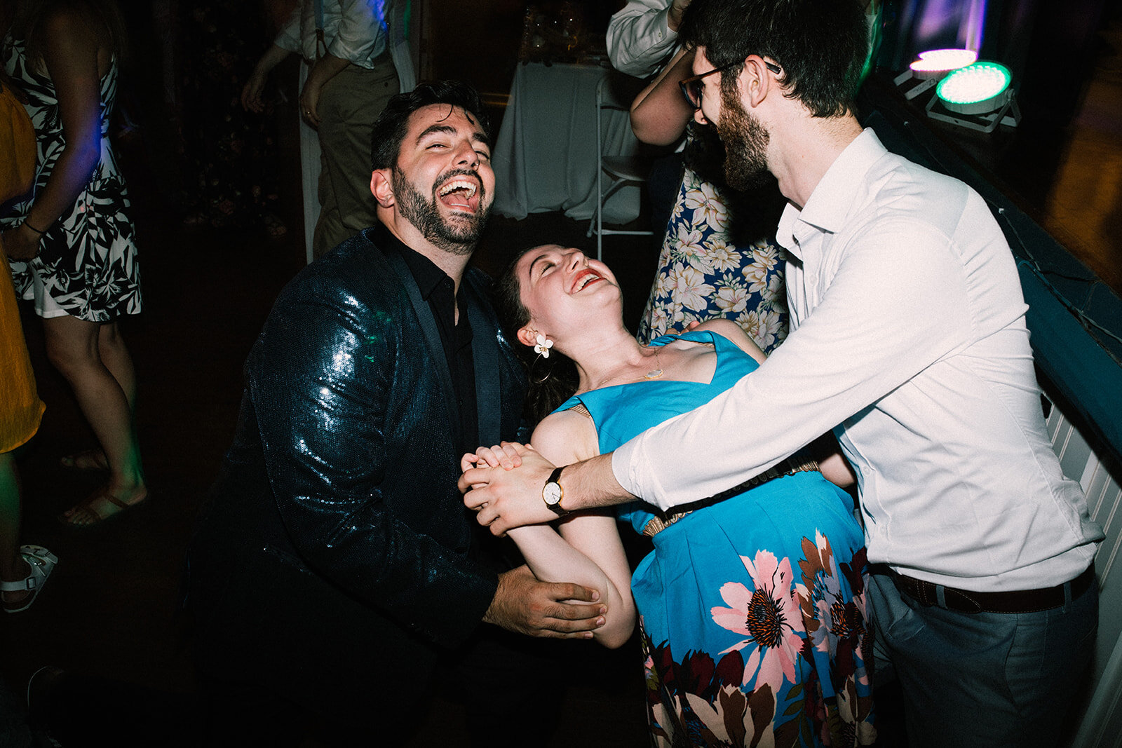 Wedding guests and newlywed dancing in Portland ME Shawnee Custalow Queer wedding photography