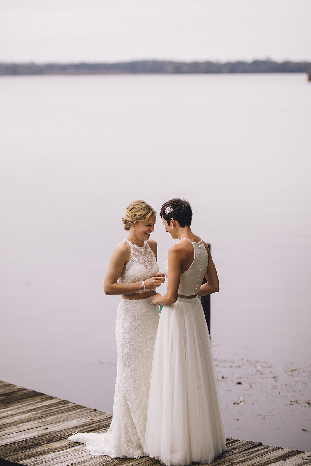 Brides by a lake in Virginia Shawnee Custalow wedding photography