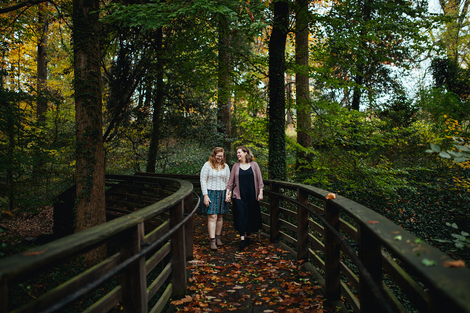 Future spouses walking on a bridge in Richmond VA Shawnee Custalow photography