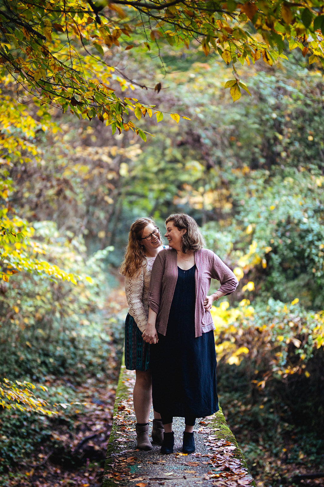 Engaged couple holding hands in Forest Hill Park in RVA Shawnee Custalow photography