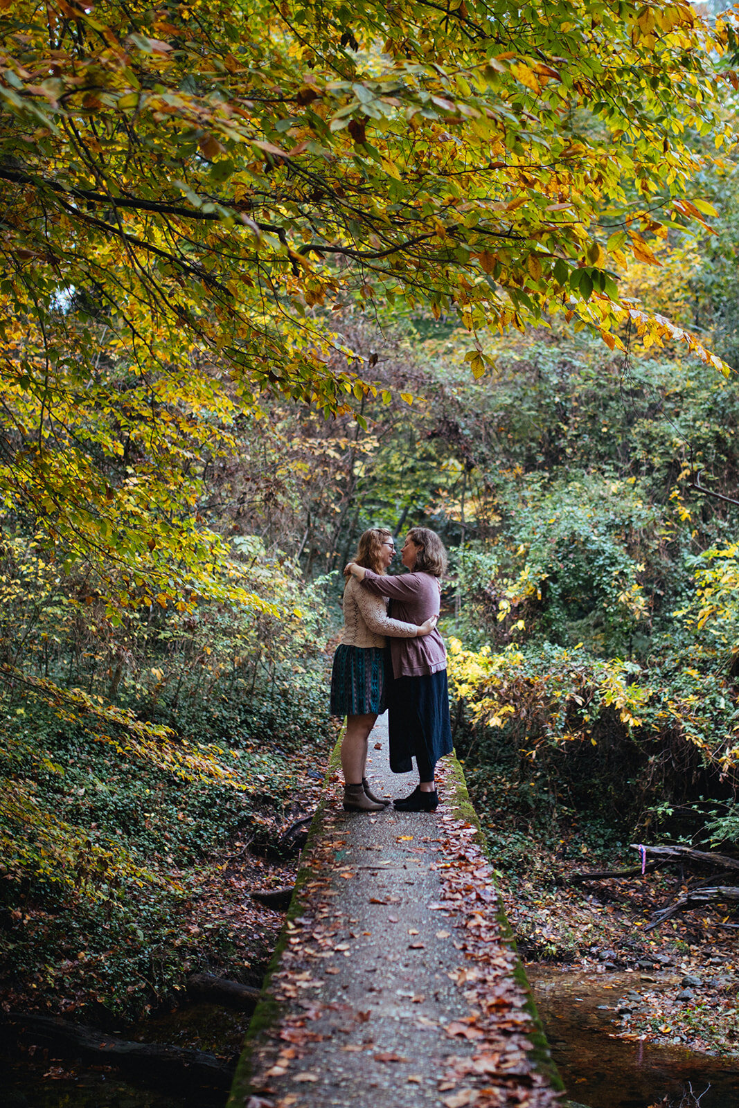 Engaged lgbtq couple embracing outside in RVA Shawnee Custalow photography