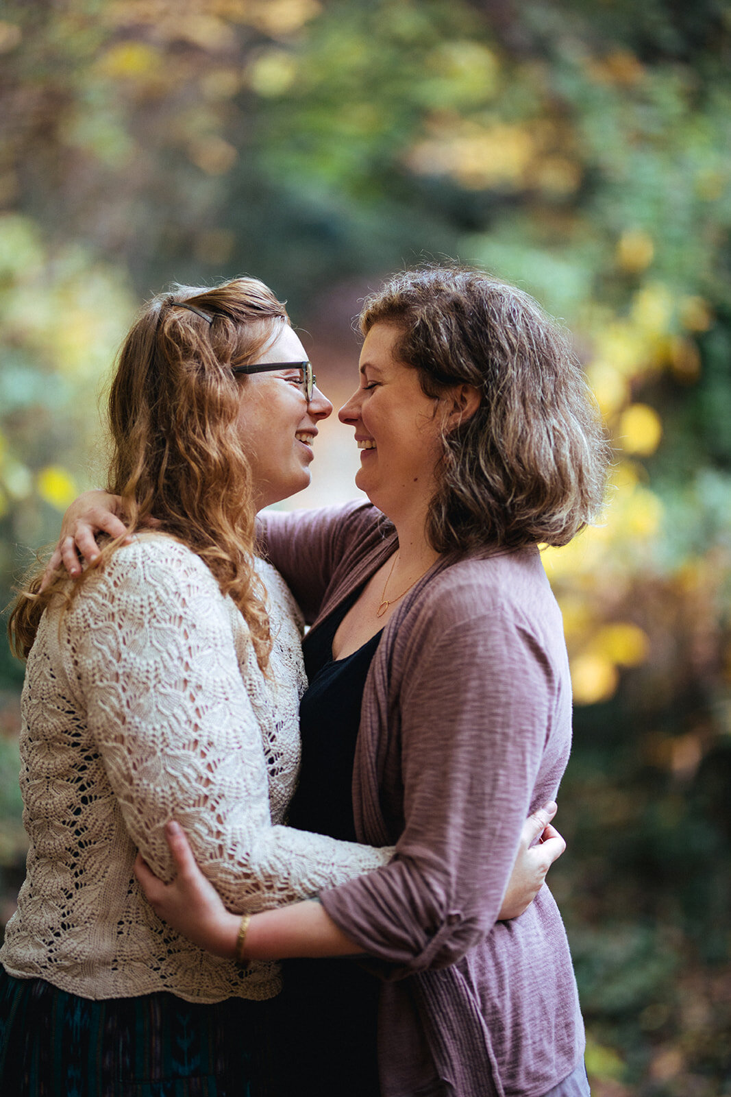 Engaged queer couple lean in to kiss in Forest Hill Park RVA Shawnee Custalow photography