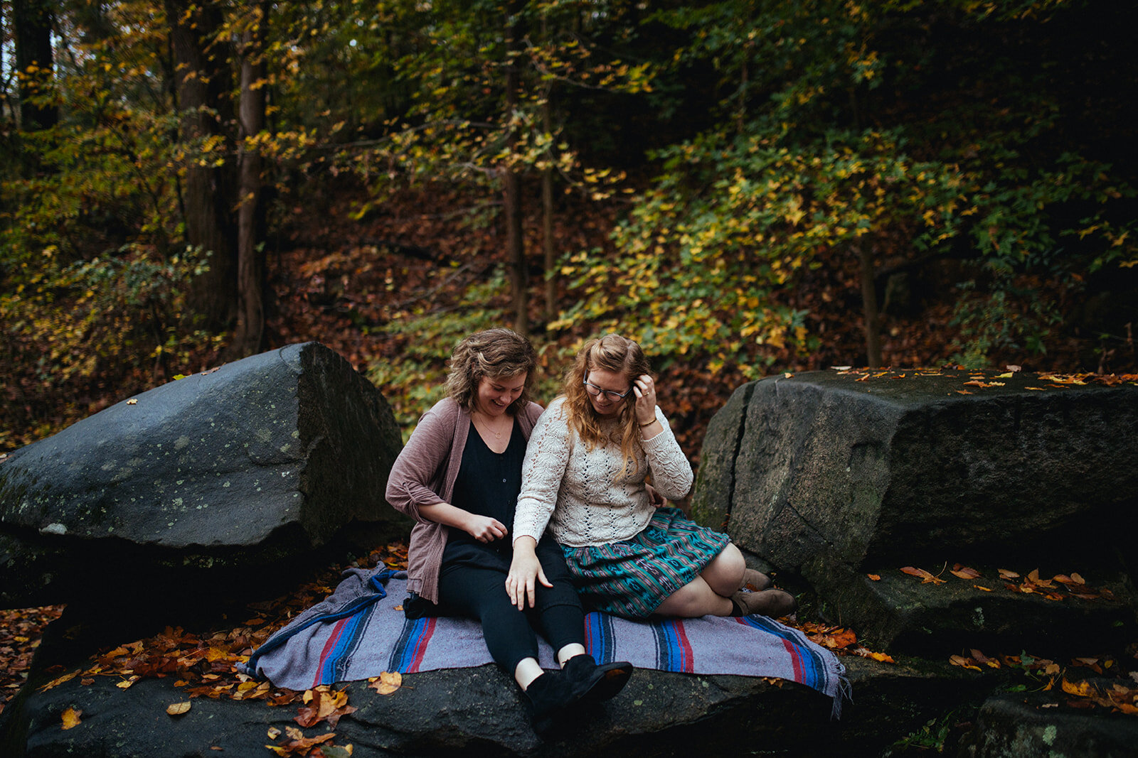 Engaged queer couple on a blanket in Forest Hill Park RVA Shawnee Custalow photography