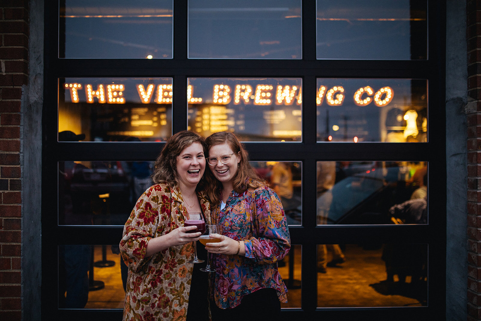 Engaged couple drinking at The Veil Brewing Co Richmond VA Shawnee Custalow photography