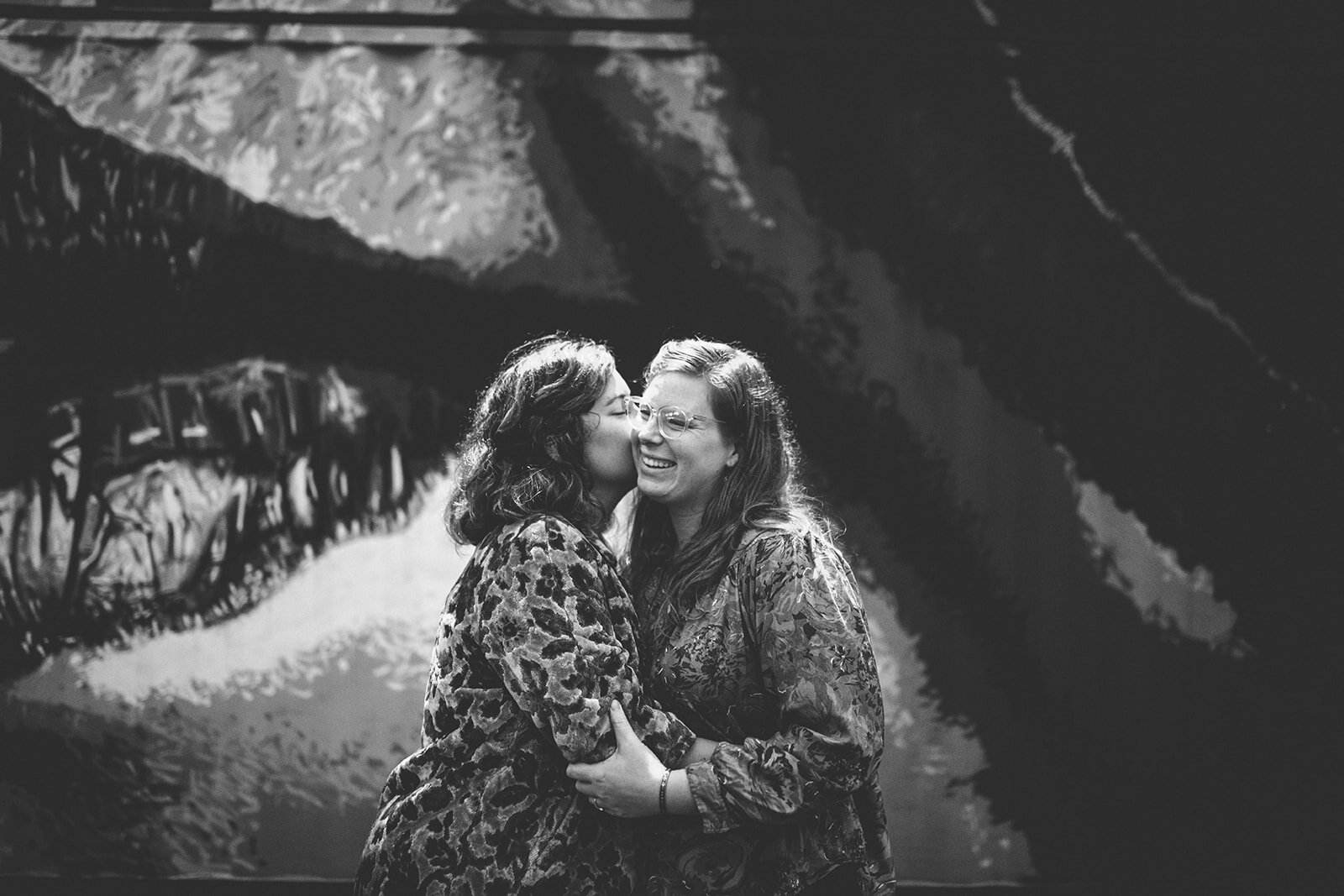 Spouse kissing their fiance at The Veil Brewing Co Richmond VA Shawnee Custalow photography