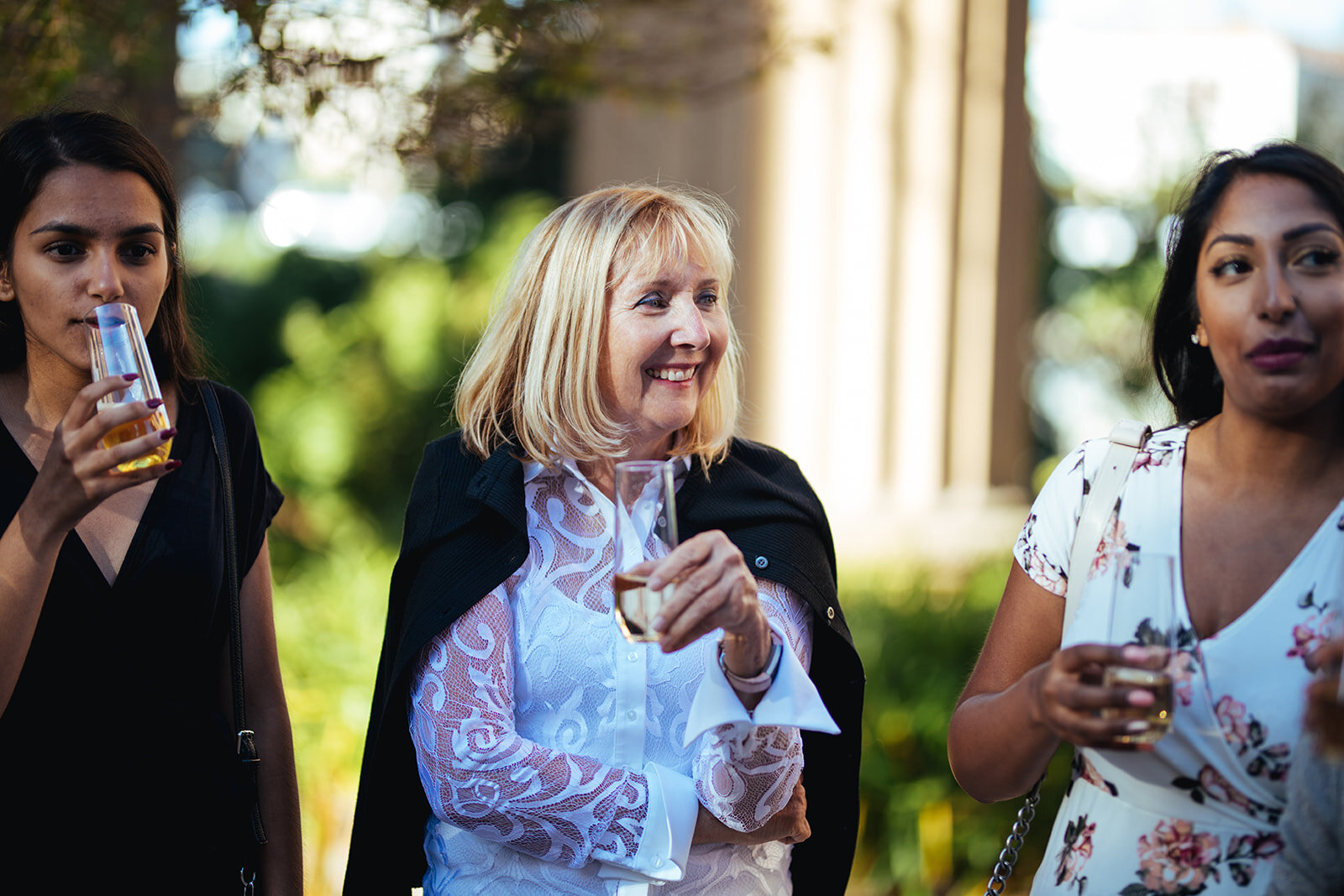 Wedding guests drinking at the Palace of the Fine Arts Shawnee Custalow