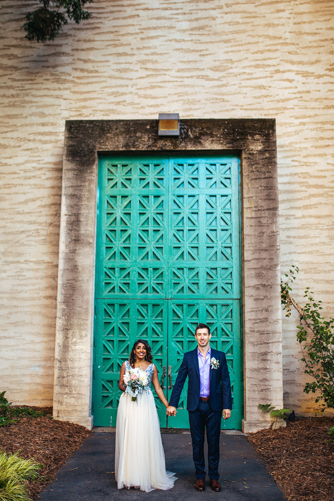 Newlyweds hand in hand at the Palace of Fine Arts CA Shawnee Custalow Photography