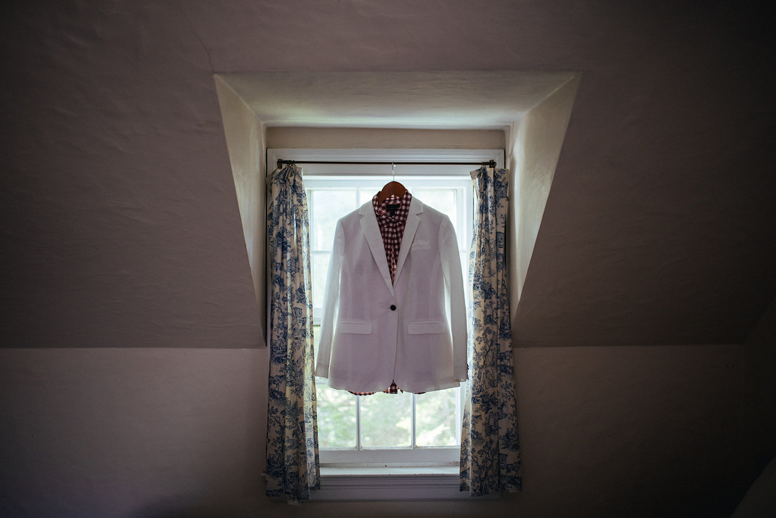 White suit hanging in Cape Cod Shawnee Custalow wedding photography