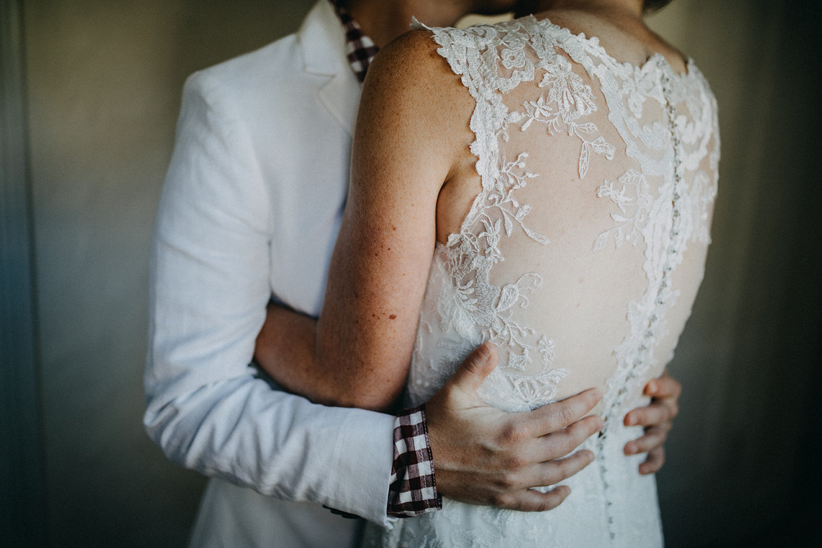 LGBTQ couple embrace in Cape Cod Shawnee Custalow wedding photography