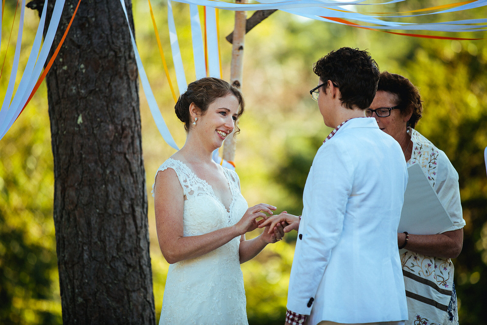 Spouses exchange rings in Cape Cod Shawnee Custalow photography