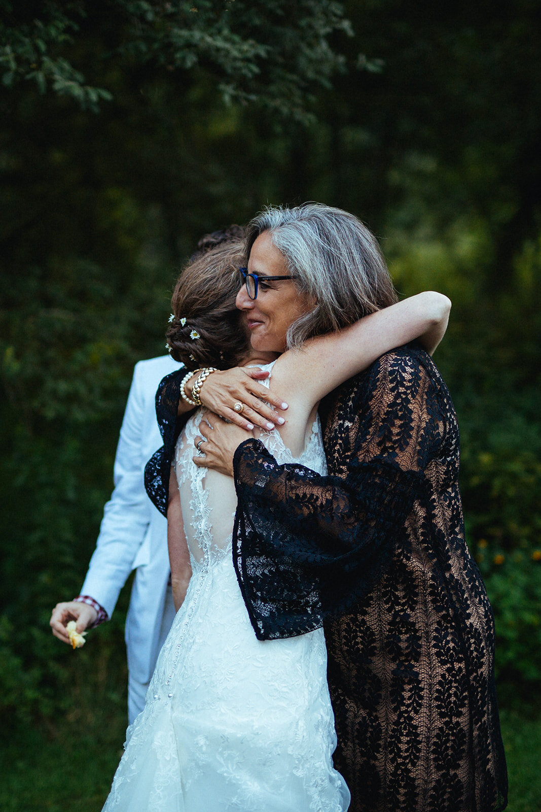 Bride hugging guest in Cape Cod Shawnee Custalow wedding photographer