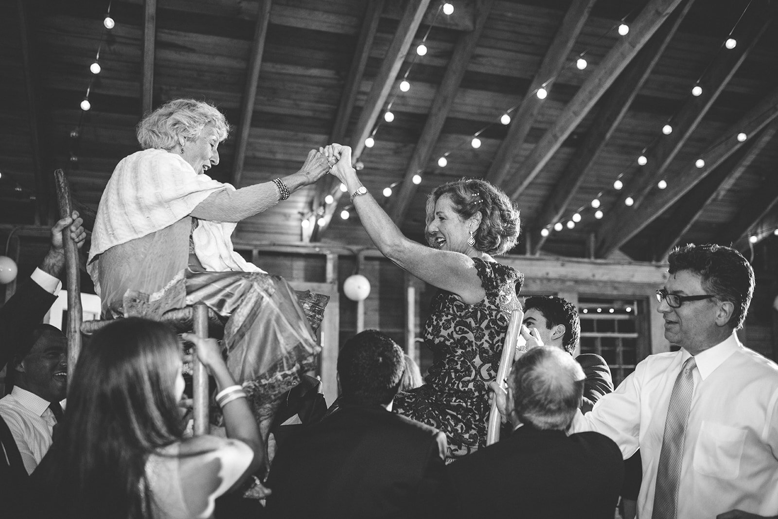 Wedding guests dance the horah in Cape Cod Shawnee Custalow photo