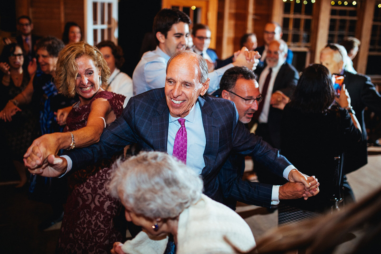 Wedding guests dance the horah in Cape Cod Shawnee Custalow photo