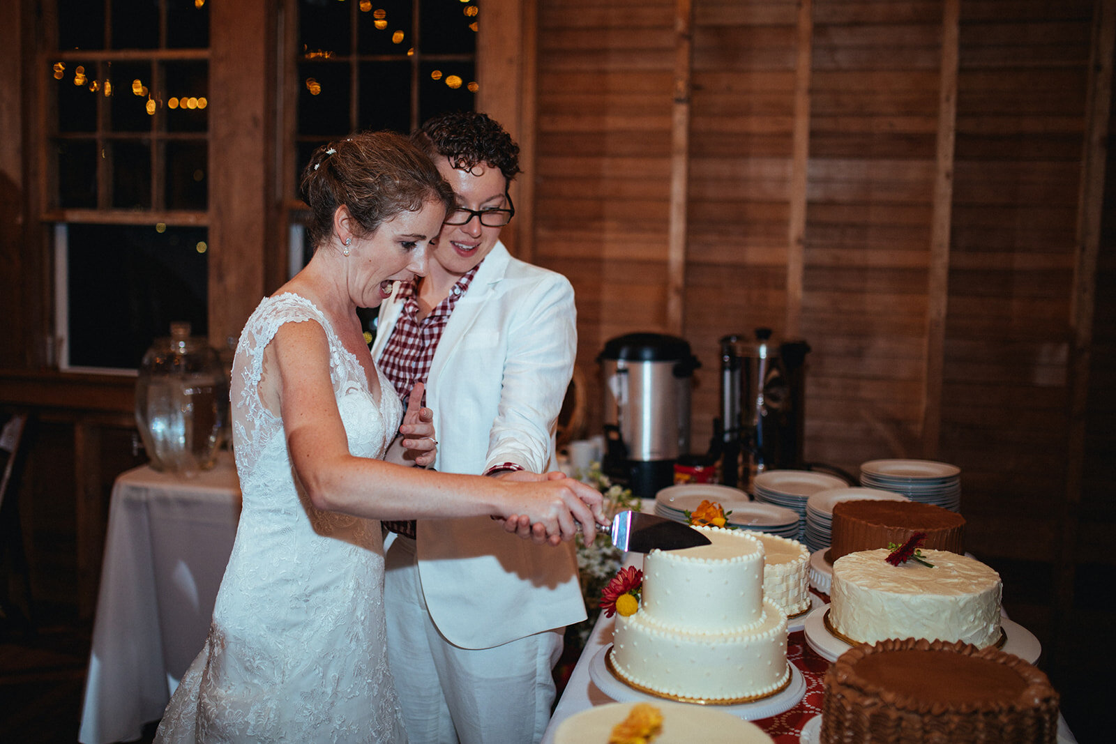 Newlyweds cut the cake in Cape Cod Shawnee Custalow photography