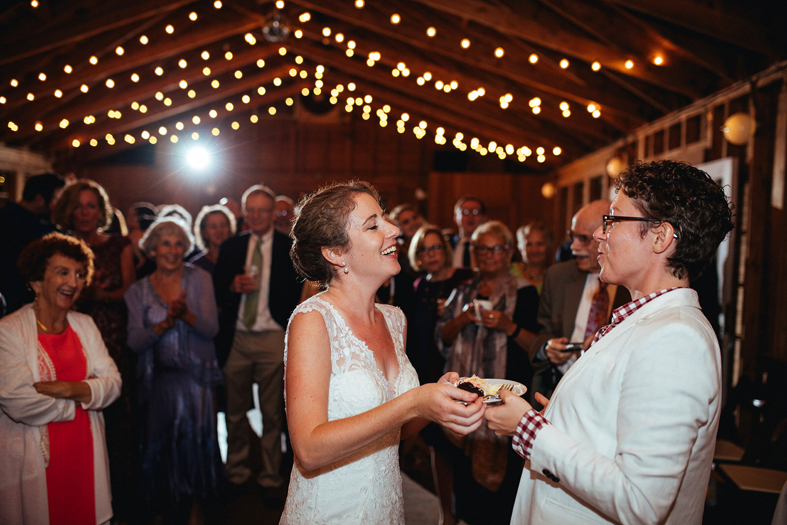 Newlyweds eating cake in Cape Cod Shawnee Custalow photography