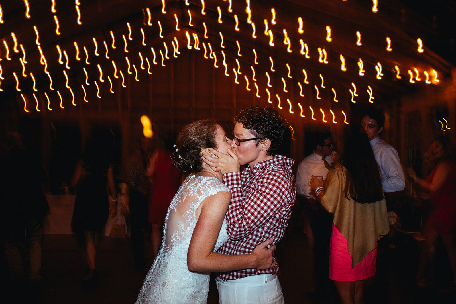 Newlyweds kissing at Cape Cod reception Shawnee Custalow photography