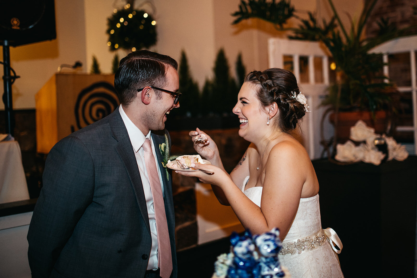 Newlyweds eating cake in Hartford CT Shawnee Custalow photography