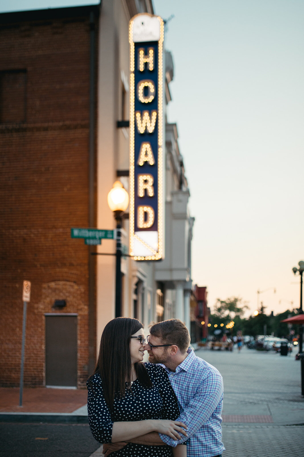 Engaged couple lean in for a kiss in DC Shawnee Custalow photography
