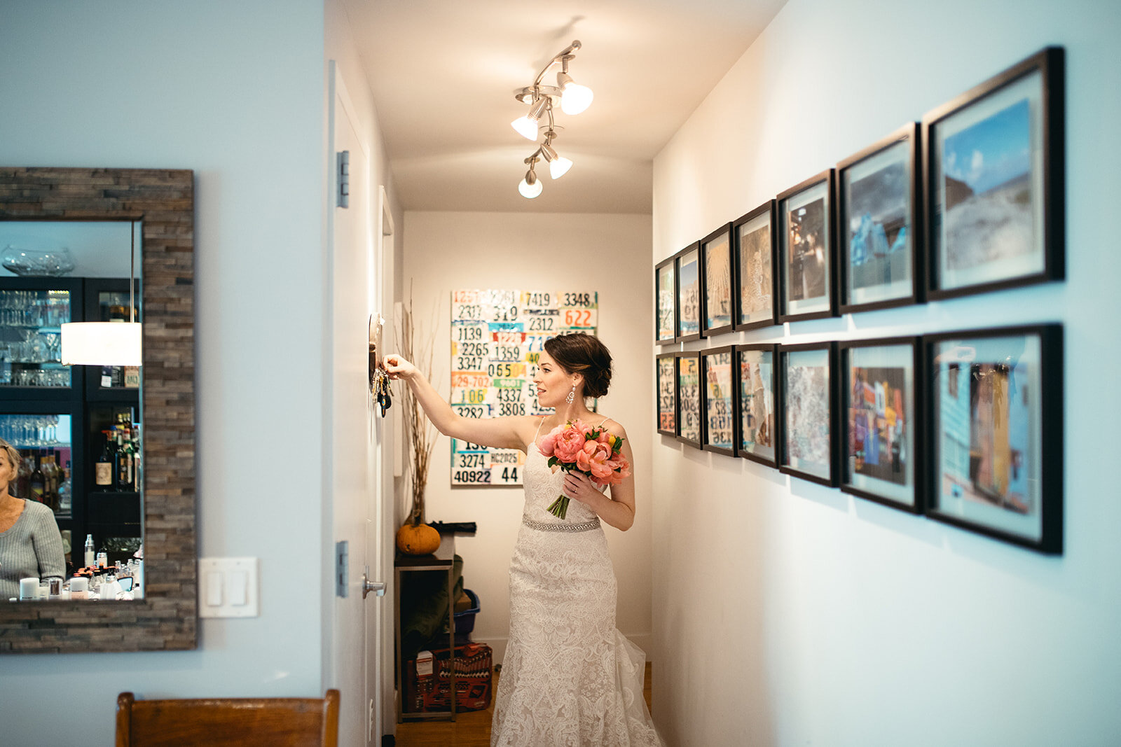 Bride with bouquet hanging keys in Brooklyn home NYC Shawnee Custalow photography